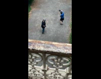 Two men in gear practices arnis stick