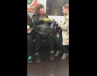 woman kisses dinosaur hand puppet 