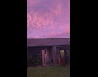 Violet colored sky surrounds the filmers house