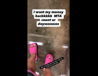 Submitter in pink slides treading through subway flood 