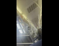 Man licks his sneakers ride inside the train