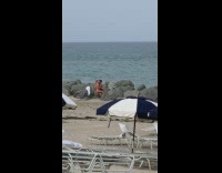 Couple kiss make out on rock beach part 1