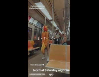 Girl wearing seahorse costume films cowboy on subway 