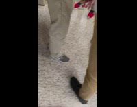 Hand turns water fountain sprays friends pants 