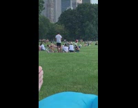 Person wears bunny ears at picnic 