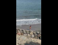 Woman brown bikini dance on the beach