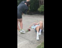 Girl lays on back friend red flowers 