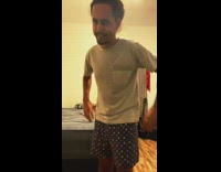Guy in boxers gets in bed