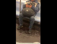 Man loud moan on phone inside train