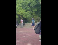Woman dances to green day busker 