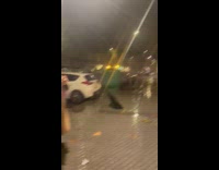 Woman broke her umbrella from strong wind