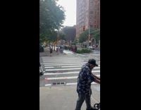 Collab winy - Woman transporting pile of red wooden chairs