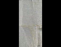 Water flows under the ice formed on the wall