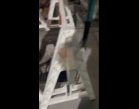 Two holes on sidewalk under the barrier