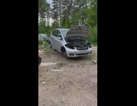 Two guys pull grey car to side with black car 
