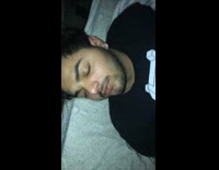 Guy slaps sleeping friends awake blue wall