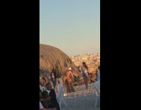 Girl grey dress hold heels beach blocks