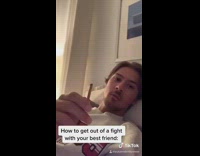 Guy girl take turns biting pretzel stick 