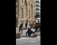 Bronze bull sculpture girl beige brown bodysuit 