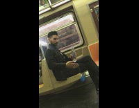 Man plays with blue yoyo on the subway