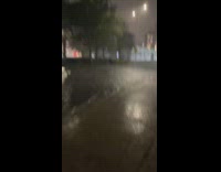 water gushes out of floor in street