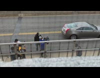 Man music video shoot face mask crew sidewalk