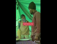 Collab BitchIG2 - Guy explaining prosthetic arm to guy in green tent