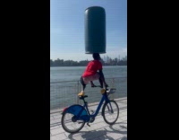 Man carry barrel stand on bike park