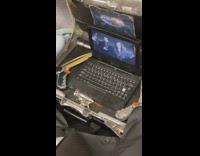 Man has computer set up inside suitcase 