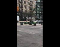 Guy drives lawn tractor 