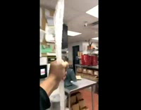 Guy carries huge icicle and tries to put it in fryer 