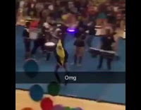 Guy dressed in banana costume runs through pep rally 