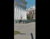 Two girls match beige leggings dance pillar