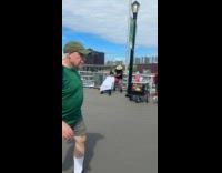 Teen getting haircut at boardwalk