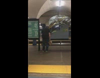 Collab Subway Creatures - A man in black shirt slowly bending down