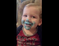 Baby monster sounds with cake on face
