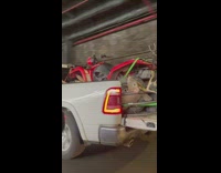 Pickup truck with ATV and fake deer in the bac k