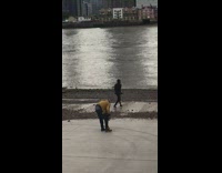 Black hat guy poses river yellow jacket