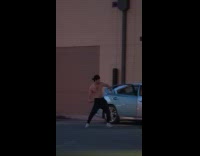 Group of men shirtless dances on the drive-thru booth