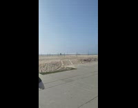 Girl black shorts crab pose beach stone