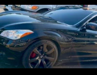 Collab WINY - Chucky doll on car sunroof look at filmer