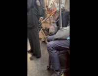 Collab Subway Creatures - Man wears clown costume on train ride