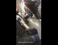 person with black coat push ups on train floor