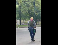 Pink rat on mans shoulder with long hair