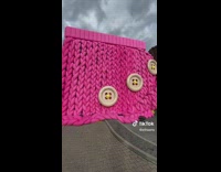 Guy shows Mcdonalds covered in knitted threads as design 