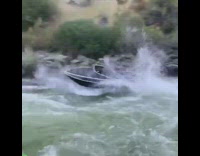 Boat goes over wave and jumps river 