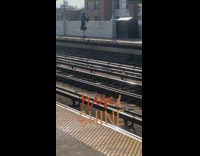 Guy playing bagpipes at subway station