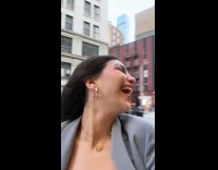 Girl in grey dress and blazer walking