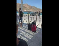 Woman tiktok dance with people around her in a line