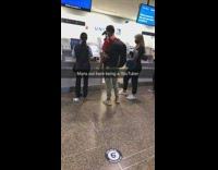 Man red shirt film plane ticket airport